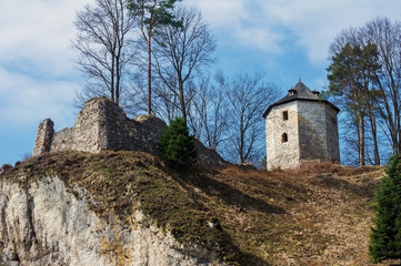 The ruins of the old castle walls on the hill.