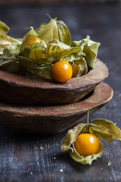 Wooden bowls of physalis