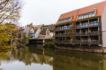 Fototapeta na wymiar Cityscape from river Pegnitz in Nurnberg, with living houses on shore in Bavarian town, Nuremberg, Germany