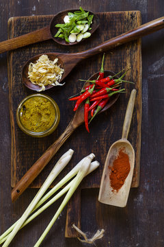 Ingredients of Asian curry paste on wooden board