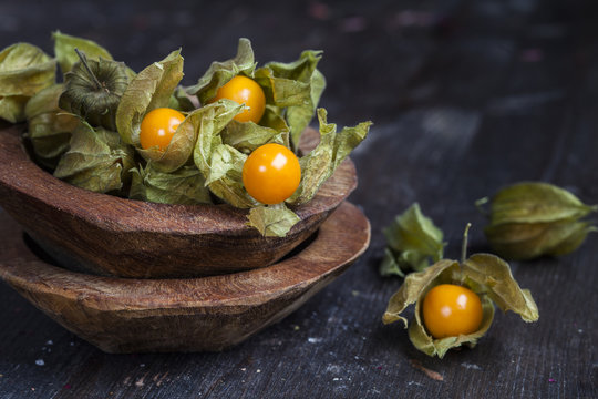 Wooden bowls of physalis