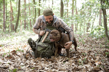 Man with dog in forest