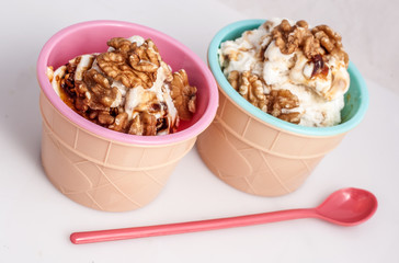 Panna cotta ice cream decorated with walnuts.