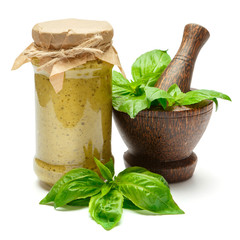 Pesto Sauce with fresh Basil leaves on White Background Studio shot