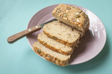 Multi-Grain Bread slice with knife on ceramic plate, healthy food concept