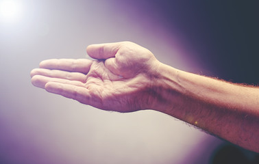 Hand raise with the palm opened up