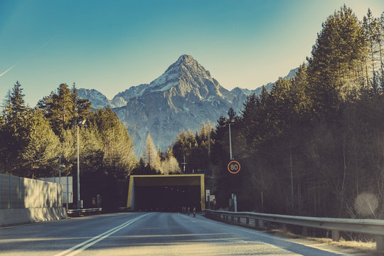 Germany, Bavaria, Tunnel and speed limit sign in front of Zugspitze mountain