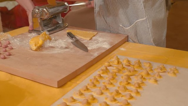 Preparing Tortellini In Italy. Traditional hand made pasta with meat and Parmesan cheese. 4K UHD