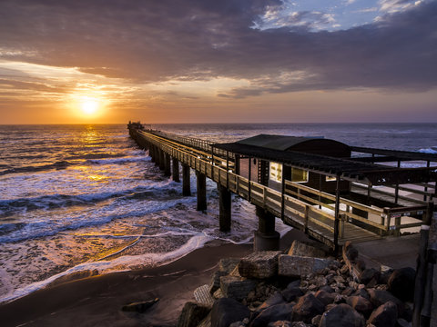 Namibia, Swakopmund, wooden boardwalk at sunset