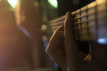 Handsome young men playing guitar