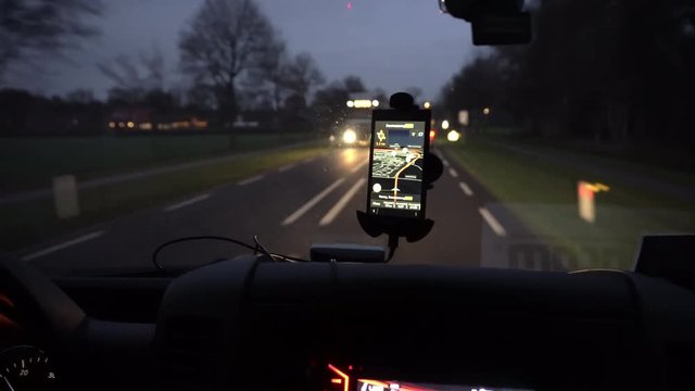 GPS navigation tracking vehicle location and route while driving on road. GPS navigation on smartphone showing route.