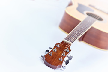Naklejka na ściany i meble Acoustic guitar isolated on white background .