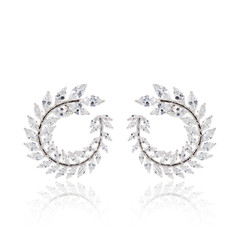 Pair of diamond earrings isolated on white