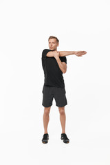 Sportsman on white stretching hands