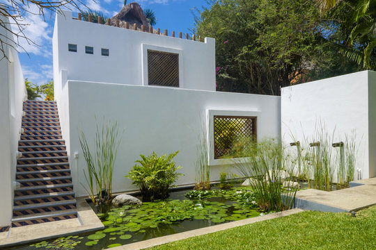 Mexico, Punta de Mita, guesthouse with lily pond in the foreground