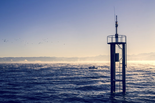 Switzerland, Arbon, measuring station at Lake Constance by twilight
