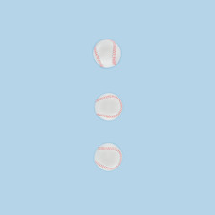 Baseball balls in a row isolated on blue