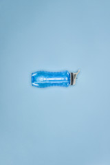 Sports water bottle isolated on blue background