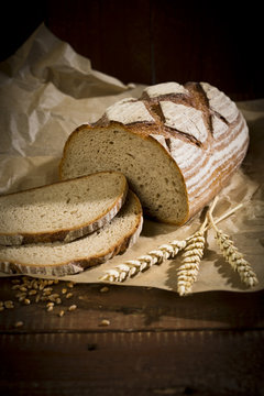 Brown bread on wood, slices, spikes