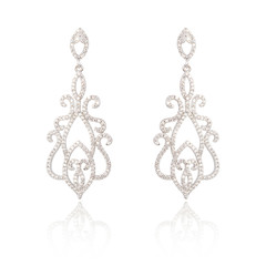 Pair of silver diamond earrings isolated on white