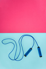 Skipping rope isolated on pink and blue