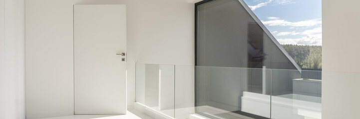White hall wiith glass balustrade