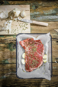 Row beefsteak with herbs and garlic