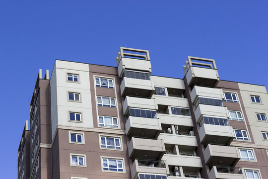 Cropped shot of high rised concrete building on sunny day