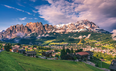 View of Cortina D'Ampezzo with Pomagagnon mount in the background, Dolomites, Italy, South Tyrol. - obrazy, fototapety, plakaty