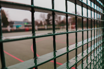 Basketball Court Through Metal Mesh Fence