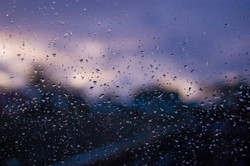 On a wet glass, drops of water are clearly visible in the evening_