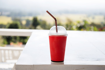 Red coffee cup on table