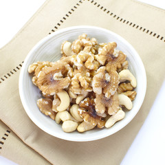 Assorted mixed nuts in white bowl