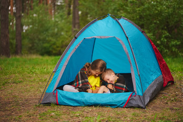 happy children hiking in the forest