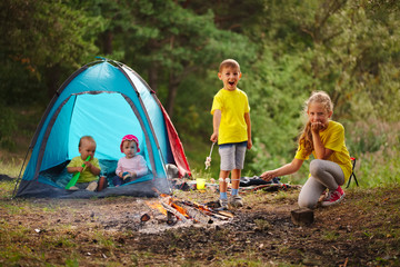 happy children hiking in the forest