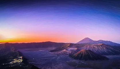 Fotobehang Mount Bromo volcano (Gunung Bromo) at sunrise with star trail in Bromo Tengger Semeru National Park, East Java, Indonesia. © nuttawutnuy