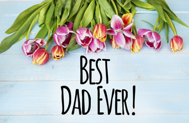 Tulips on a Blue Planks with "best Dad ever" Quote. Father's Day Card