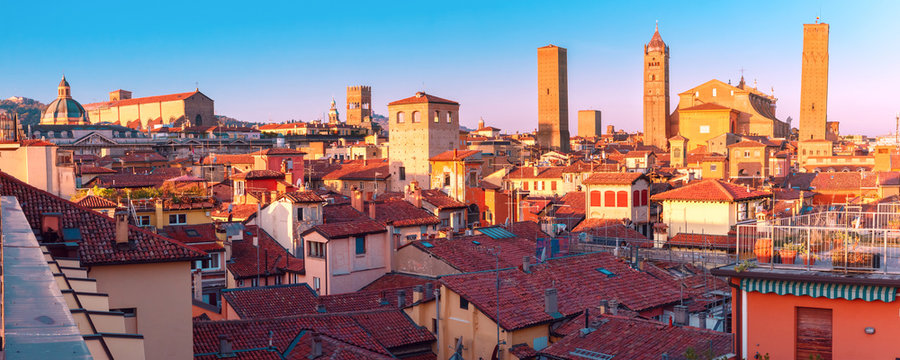 Aerial panoramic view of Bologna Cathedral and towers towering above of the roofs of Old Town in medieval city Bologna in the sunny day, Emilia-Romagna, Italy