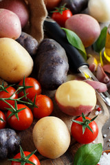 Raw potatoes and vegetables