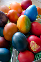 Fototapeta na wymiar colorful Easter eggs in basket isolated, close up top view