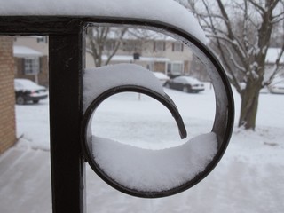 Spiral handrail covered in snow