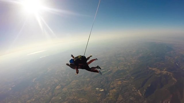 Jump skydiving. Two crazy young men Tandem jumping from the plane