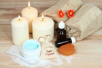 Fototapeta na wymiar Spa concept with candles, bath crystals, essential oil, towel, body cream 