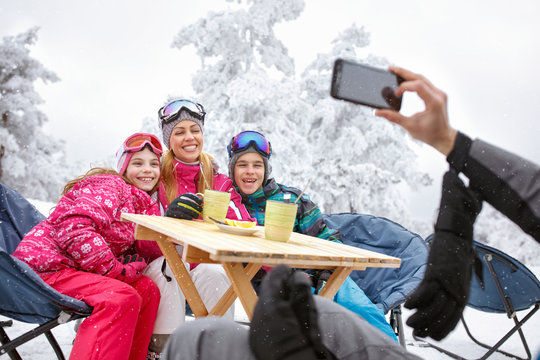 Happy family together at winter holiday on skiing