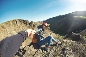 portrait of woman traveler on a walk in the Valley of the river of Hveragerdi Iceland. Hiking Tour of Reykjadalur Hot Springs