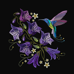 Embroidery violet flowers bells and humming bird. Beautiful violet cornflowers and humming bird, classical art embroidery. Fashionable template for design of clothes