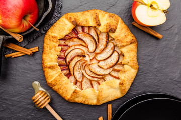 Baked galette or open pie with apples on the table