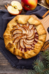 Baked galette or open pie with apples on the table