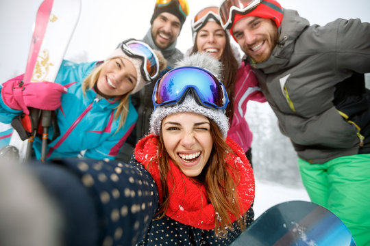 Girl on skiing with group of friends