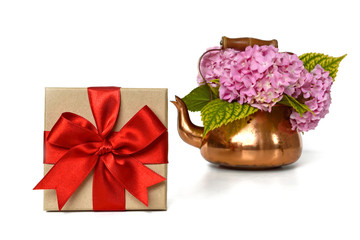 Gift box and flowers isolated on white background